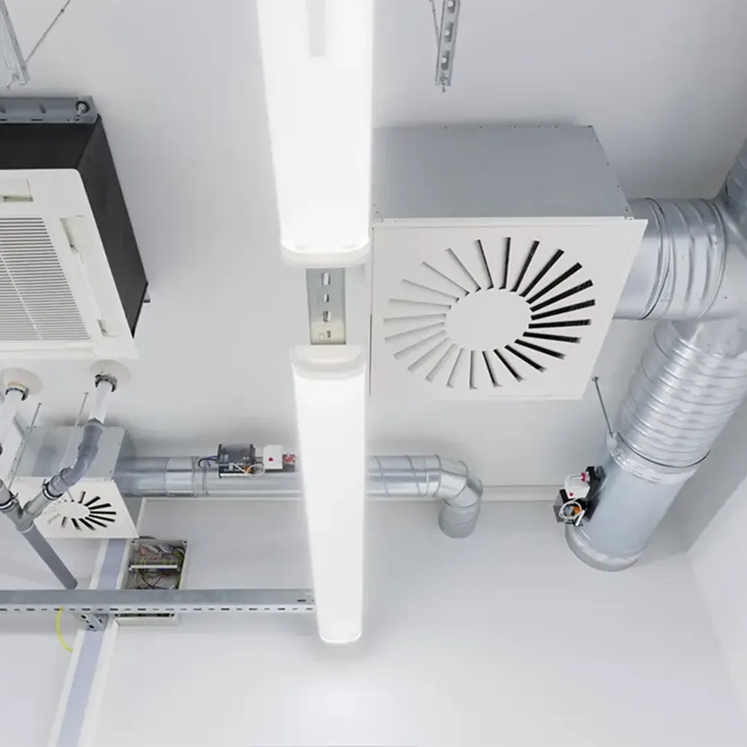 A Morgan M technician performing a seasonal HVAC tune-up